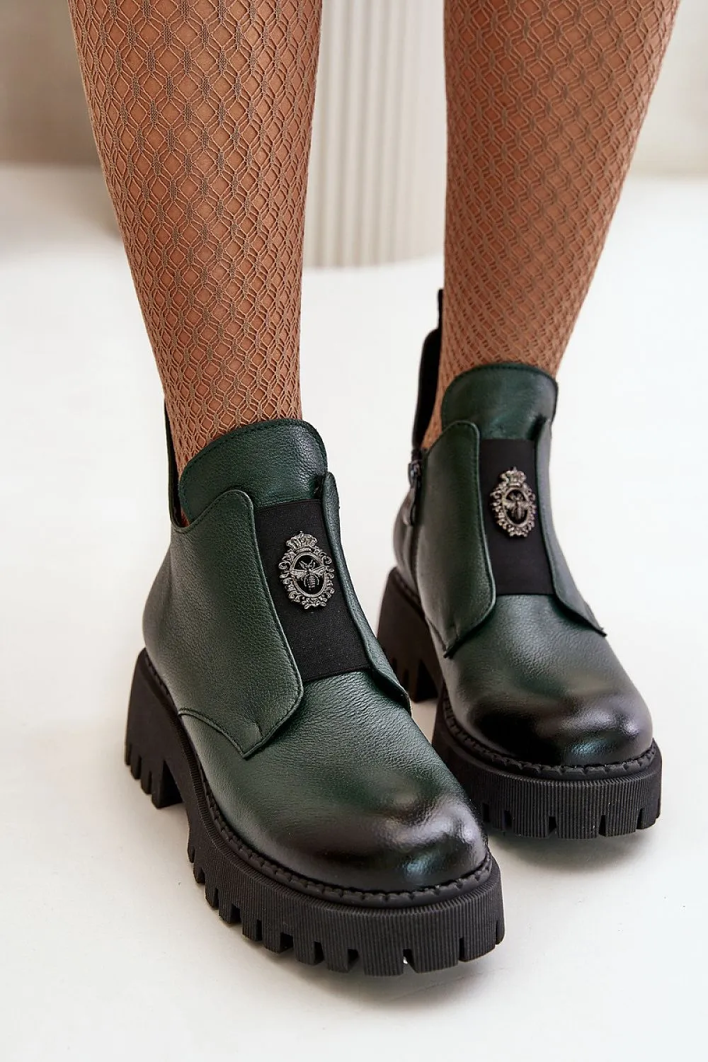 Natural leather boots on platform with grooves